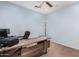 Cozy office space with wooden desk, chair and a ceiling fan for added comfort at 12911 W Campbell Ave, Litchfield Park, AZ 85340