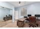 Bright office space with a wooden desk and walk in closet provides lots of storage at 12911 W Campbell Ave, Litchfield Park, AZ 85340