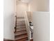 Staircase leading to the second floor with tile and hardwood steps at 12911 W Campbell Ave, Litchfield Park, AZ 85340