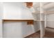 Walk-in closet featuring shelving on white walls at 12911 W Campbell Ave, Litchfield Park, AZ 85340