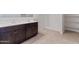 Bathroom with double sinks, wood cabinets, and a step-in shower and built-in shelving at 1314 W Kennedy Ave, Coolidge, AZ 85128