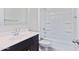 Bathroom with white vanity, tiled floors, and tub with shower at 1314 W Kennedy Ave, Coolidge, AZ 85128