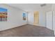 Spacious carpeted bedroom with bright natural light; ensuite bathroom at 1314 W Kennedy Ave, Coolidge, AZ 85128