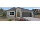 Charming single-story home boasts a neutral color palette, desert landscaping, and a two-car garage at 1314 W Kennedy Ave, Coolidge, AZ 85128