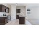 Beautiful kitchen featuring granite countertops, stainless steel appliances, dark cabinetry and tile flooring at 1314 W Kennedy Ave, Coolidge, AZ 85128