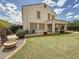 Expansive backyard with lush lawn, a covered patio, and ample space for entertaining and relaxation at 1350 E Racine Dr, Casa Grande, AZ 85122
