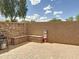 Backyard brick patio with built-in seating, grill, and gas fire pit; perfect for outdoor entertaining at 1350 E Racine Dr, Casa Grande, AZ 85122