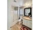 Well-lit bathroom features a shower-tub combo and a vanity with granite countertops at 1350 E Racine Dr, Casa Grande, AZ 85122