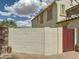 Exterior brick wall and gate offering privacy and security for outdoor living spaces at 1350 E Racine Dr, Casa Grande, AZ 85122