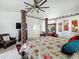 Inviting main bedroom featuring a four-poster bed, wooden furniture, and a ceiling fan at 1350 E Racine Dr, Casa Grande, AZ 85122