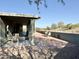 This home features a charming outdoor patio area perfect for entertaining and beautiful desert landscaping at 1421 W Rylie Ct, Queen Creek, AZ 85144