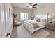 Well-lit bedroom featuring a charming bed, soft-toned walls, and sleek furnishings create a cozy, inviting atmosphere at 1421 W Rylie Ct, Queen Creek, AZ 85144