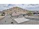 This home's exterior features desert landscaping, mountain views, and a three car garage at 1421 W Rylie Ct, Queen Creek, AZ 85144