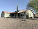 Charming single story home featuring a two car garage, desert landscaping, and mature cacti at 1421 W Rylie Ct, Queen Creek, AZ 85144