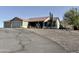Charming single story home featuring a two car garage, desert landscaping, and a tile roof at 1421 W Rylie Ct, Queen Creek, AZ 85144
