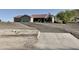 Desert home with three-car garage, tile roof, and xeriscaped front yard at 1421 W Rylie Ct, Queen Creek, AZ 85144