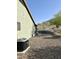A home exterior featuring desert landscaping and an air conditioning unit at 1421 W Rylie Ct, Queen Creek, AZ 85144
