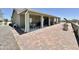 Charming home exterior with a spacious tiled patio for outdoor enjoyment at 1421 W Rylie Ct, Queen Creek, AZ 85144