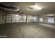 Spacious three-car garage with ample room for vehicles, storage, and potential workshop space, ensuring functionality at 1421 W Rylie Ct, Queen Creek, AZ 85144