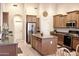 Beautiful kitchen featuring an island, stainless steel appliances and lots of storage at 1421 W Rylie Ct, Queen Creek, AZ 85144