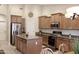 Beautiful kitchen featuring an island, stainless steel appliances and lots of storage at 1421 W Rylie Ct, Queen Creek, AZ 85144
