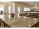 Spacious kitchen featuring granite countertops, stainless steel appliances, and ample cabinet space at 1421 W Rylie Ct, Queen Creek, AZ 85144