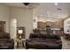 Inviting living room with recessed lighting, comfortable seating, and an open floor plan at 1421 W Rylie Ct, Queen Creek, AZ 85144