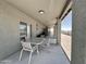 Relax on the covered patio with outdoor seating and desert views at 1421 W Rylie Ct, Queen Creek, AZ 85144