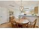 Cozy dining area featuring a wood table, four chairs and a decorative chandelier at 14300 W Bell Rd # 145, Surprise, AZ 85374
