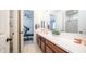 Elegant bathroom with a double vanity, spacious countertops, and modern fixtures at 14637 W Wethersfield Rd, Surprise, AZ 85379