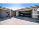 Spacious driveway leading to a three-car garage filled with parked vehicles at 14637 W Wethersfield Rd, Surprise, AZ 85379