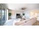 Bright living room with a cozy sectional sofa and access to outdoor patio at 14637 W Wethersfield Rd, Surprise, AZ 85379