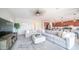 Comfortable living room with a sectional sofa and an open view to the kitchen at 14637 W Wethersfield Rd, Surprise, AZ 85379