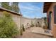 Private backyard boasts desert landscaping with cacti, gravel, and comfortable seating on a patio at 15601 N 27Th St # 37, Phoenix, AZ 85032