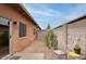 Cozy backyard features desert landscaping, gravel, and a patio with comfortable seating at 15601 N 27Th St # 37, Phoenix, AZ 85032