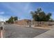 Community exterior view showing a gated entrance, street, sidewalk, and landscaped surroundings at 15601 N 27Th St # 37, Phoenix, AZ 85032
