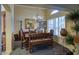 Formal dining room with elegant chandelier and shuttered windows at 16112 W Whitton Ave, Goodyear, AZ 85395