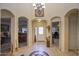 Welcoming foyer with tile flooring, decorative inlays, and high ceilings at 16112 W Whitton Ave, Goodyear, AZ 85395