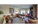 Cozy living room with built-in bookcase, plush seating, and neutral decor at 16112 W Whitton Ave, Goodyear, AZ 85395
