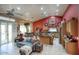 Bright living space with vaulted ceilings, tile flooring, and open layout at 16112 W Whitton Ave, Goodyear, AZ 85395