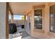 Back patio with barbeque, covered seating, and view to the backyard at 17152 W Watkins St, Goodyear, AZ 85338
