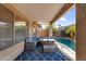 Covered patio with outdoor seating area, string lights, and a view of the pool at 17152 W Watkins St, Goodyear, AZ 85338