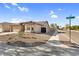 Charming single-story home featuring desert landscaping, tile roof, and a two-car garage at 17152 W Watkins St, Goodyear, AZ 85338