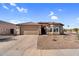 Charming single-story home featuring desert landscaping and a two-car garage at 17152 W Watkins St, Goodyear, AZ 85338
