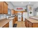 Bright kitchen with ample cabinet space, modern appliances, and tiled flooring at 17152 W Watkins St, Goodyear, AZ 85338