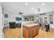 Open-concept living area with integrated kitchen and dining space, perfect for entertaining at 17152 W Watkins St, Goodyear, AZ 85338