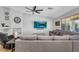 Spacious living room featuring a large sectional and neutral color palette at 17152 W Watkins St, Goodyear, AZ 85338