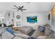 Open-concept living area with large sectional sofa and a modern entertainment setup at 17152 W Watkins St, Goodyear, AZ 85338