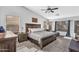 Spacious primary bedroom featuring a large bed, sitting area, and ample natural light from large windows at 17152 W Watkins St, Goodyear, AZ 85338