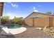 Backyard pool surrounded by desert landscaping and rock accents at 17152 W Watkins St, Goodyear, AZ 85338